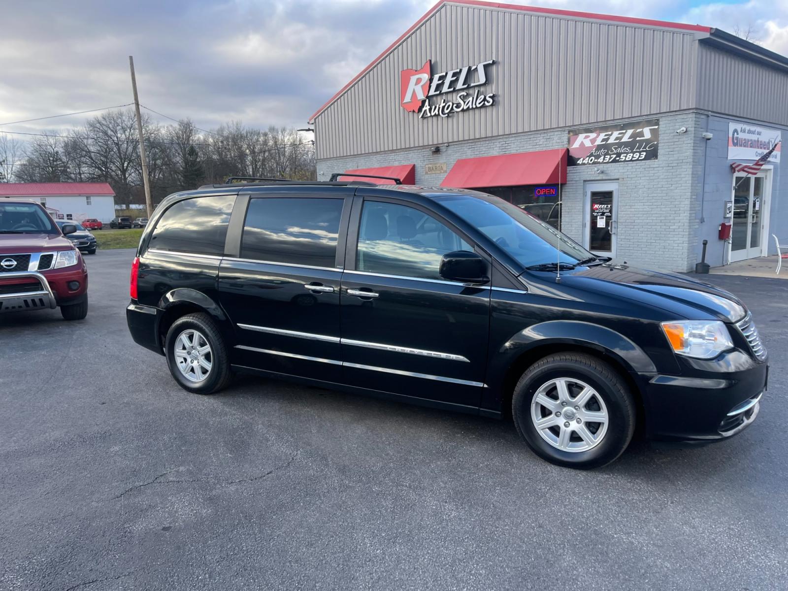 2012 Black /Black Chrysler Town & Country (2C4RC1BG0CR) with an 3.6L V6 DOHC 24V FFV engine, 6-Speed Automatic transmission, located at 11115 Chardon Rd. , Chardon, OH, 44024, (440) 214-9705, 41.580246, -81.241943 - This 2012 Chrysler Town & Country Touring - L model features a luxurious interior with cloth seats that are heated for comfort, complemented by a heated steering wheel for added warmth in cooler weather. It comes equipped with a convenient tow package, enhancing its utility for pulling trailers or b - Photo #3
